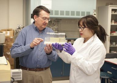 Faculty and graduate student in the lab