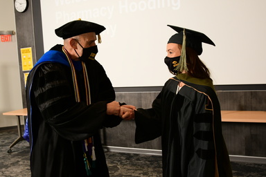 Dean Letendre Shaking Graduate Hand
