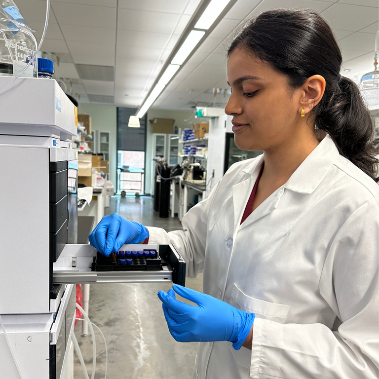 A UI Pharmaceutics Student works in the lab.