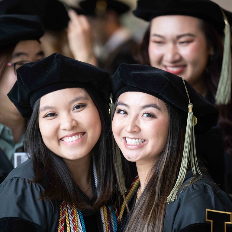 2023 PharmD Commencement - two grads pre ceremony