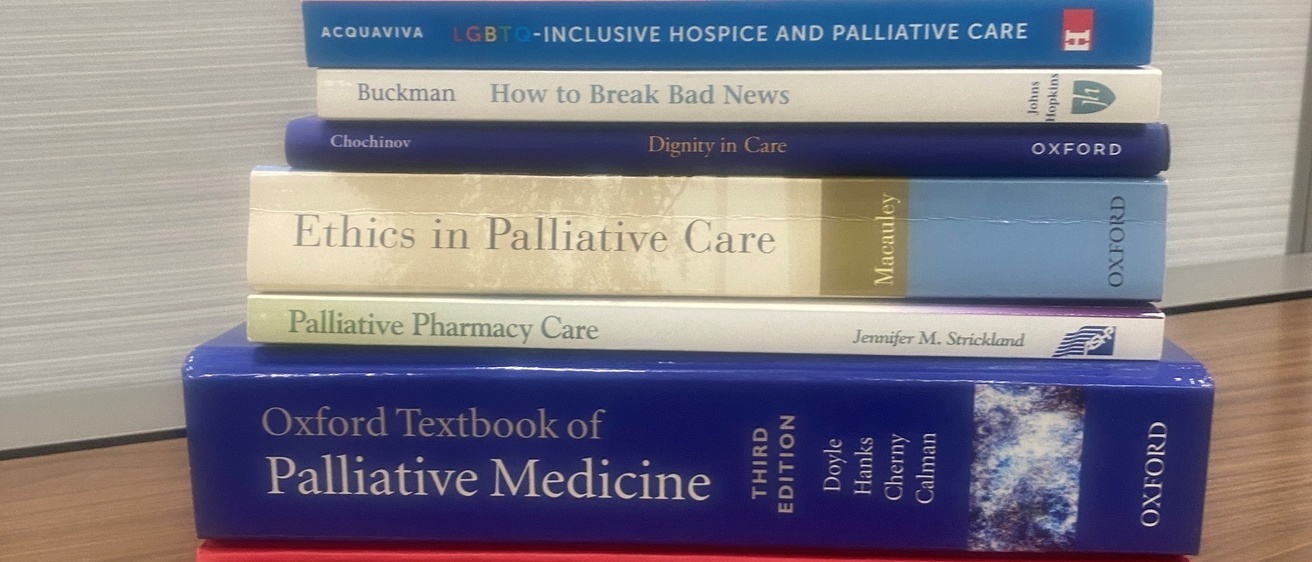 Stack of College of Pharmacy Palliative Care Text Books