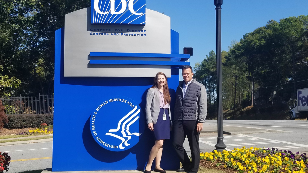Nicole Therrien and her preceptor stand outside near the CDC sign