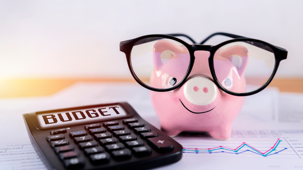 Piggy Bank Wearing Eyeglasses Overseeing Budgeting Worksheets and Calculator